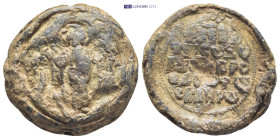 BYZANTINE LEAD SEAL. (26mm, 19.3 g) Obv: Nimbate archangel Michael, with spread wings, standing facing, holding spear.. Rev: Legend in 5 lines.
