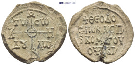 BYZANTINE LEAD SEAL. (30mm, 10.4 g) Obv: Cruciform monogram Rev: Legend in 4 lines.