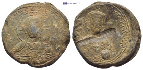 BYZANTINE LEAD SEAL. (33mm, 32.6 g) Obv: Bust of Christ Pantokrator facing, with decorated nimbus cruciger, holding book of Gospels in his left hand a...