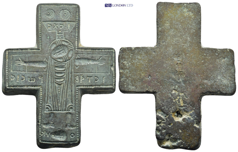 Bronze cross-shaped mold. Jesus crucified. His arms are open and his head is dow...