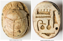 ANTIQUITIES. Egypt. Amenhotep III (ca. 13th century BC). Steatite scarab (20mm x 15mm x 10mm, 4.77 gm). As made, pierced for mounting. Cartouche hiero...