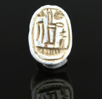 Egyptian scarab with representation of uraeus-serpent above neb-figure (“lord”), protection/luck