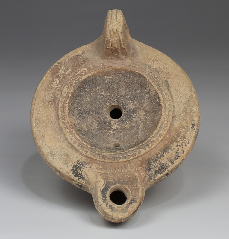 ITEM: Oil lamp, Type Bussière D II 1
 MATERIAL: Pottery
 CULTURE: Roman
 PERI...