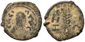 AXUM. Ezanas, circa 345-380. Ae (bronze, 0.37 g, 10 mm. ΒΑCIΛЄΥC Draped bust of Ezanas to right, wearing tight-fitting head cloth and circular earring...