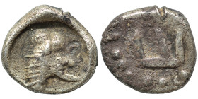 Greek. Ar (silver, 0.85 g, 9 mm). Uncertain animal standing right (bull or boar?). Rev. Uncertain pattern. Fine.