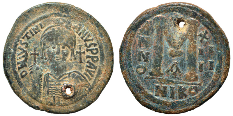 Justinian I, 527-565. Follis (bronze, 21.86 g, 39 mm), Nicomedia. Helmeted and c...