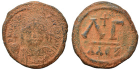 Justinian I, 527-565. 30 Nummi (bronze, 11.97 g, 28 mm), Alexandria. D N IVSTINIANVS P P AV Diademed, helmeted and cuirassed facing bust, holding glob...