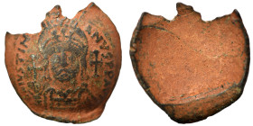 Justinian I, 527-565. Follis (bronze, 15.04 g, 35 mm), Constantinople? D N IVSTINIANVS P P AVG Helmeted and cuirrased facing bust; cross to left and r...
