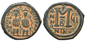 Justin II, with Sophia, 565-578. Follis (bronze, 14.21 g, 29 mm), Nicomedia. Justin, holding globus cruciger, and Sophia, holding cruciform scepter, s...