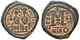 Justin II, with Sophia, 565-578. Follis (bronze, 11.88 g, 30 mm), Nicomedia. Justin, holding globus cruciger, and Sophia, holding cruciform scepter, s...