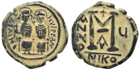 Justin II, with Sophia, 565-578. Follis (bronze, 15.93 g, 31 mm), Nicomedia. Justin, holding globus cruciger, and Sophia, holding cruciform scepter, s...