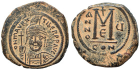 Maurice Tiberius. 582-602. Follis (bronze, 12.04 g, 30 mm), Constantinople. Draped and cuirassed bust facing, wearing plumed helmet with pendilia and ...