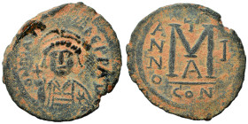 Maurice Tiberius. 582-602. Follis (bronze, 10.99 g, 27 mm), Constantinople. Draped and cuirassed bust facing, wearing plumed helmet with pendilia and ...