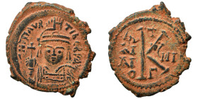 Maurice Tiberius, 582-602. Half follis (bronze, 5.76 g, 27 mm), Constantinople. Crowned and cuirassed bust facing, holding globus cruciger and shield ...