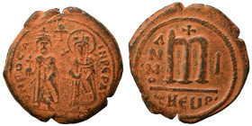 Phocas, with Leontia, 602-610. Follis (bronze, 10.19 g, 28 mm), Theoupolis (Antioch). O N FOCA NЄ PЄ AV Phocas standing facing, holding globus crucige...