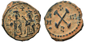 Phocas, with Leontia, 602-610. Decanummium (bronze, 2.84 g, 17 mm), Theoupolis (Antioch). Phocas and Leontia standing facing, holding globus cruciger ...