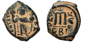 Constans II, 641-668. Follis (bronze, 6.34 g, 23 mm). Standing imperial figure holding long cross and globus cruciger. Rev. Large m, cross above, lege...