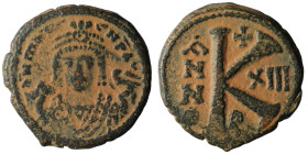 Maurice Tiberius. (582-602 AD). 1/2 Follis. Constantinople. Obv: bust of Maurice Tiberius facing. Rev: A/N/N/O K. artificial sandpatina. 22mm, 6,46g