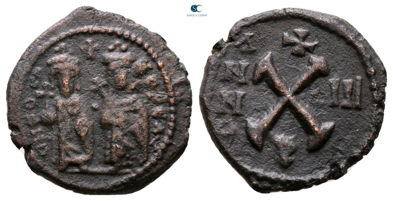 Phocas, with Leontia AD 602-610. Theoupolis (Antioch)
Decanummium Æ

16 mm, 2...