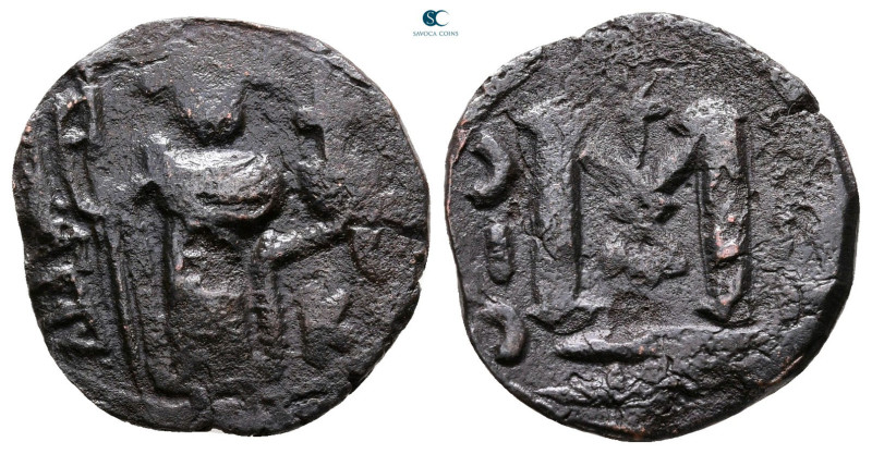 Umayyad. Abd al-Malik AH 65-86. 
Fals Æ

19 mm, 2,56 g



Fine