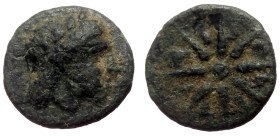 Mysia, Gambrion AE (Bronze, 0.66g, 10mm) ca 350-250 BC.
Obv: Laureate head of Apollo right within dotted circle
Rev: 12-rayed star, pellet in center...
