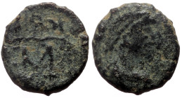 Theodosius II (402-450) AE Nummus (Bronze, 0.94g, 11mm) Constantinople (?)
Obv: Diademed, draped and cuirassed bust right 
Rev: monogram within wreath...