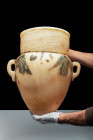 EGYPTIAN PAINTED ALABASTER VASE

 New Kingdom, 18th to 20th Dynasty, Ca. 1550 - 1069 BC An Egyptian alabaster amphora with stunning honey-yellow hue...