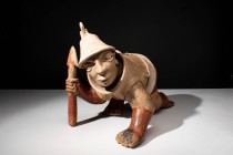 SOUTH AMERICAN FIGURINE

 Ca. 100 BC - AD 250 An ancient South American crawling warrior. This bent redware terracotta figurine is a depiction of an...