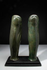 GREEK BRONZE HOPLITE GREAVES

 Ca. 700 - 500 BC A pair of matching Greek bronze greaves. Both greaves feature simple decorations including vertical ...