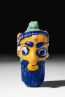 HUGE AND RARE PHOENICIAN HEAD SHAPED GLASS BEAD

 Ca. 500 - 300 BC An iconic Phoenician glass bead shaped like the head of a bearded man. The bead f...