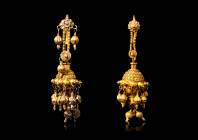 A PAIR OF HELLENISTIC GOLD EARRINGS WITH PENDANTS

 Ca. 300 - 100 BC A rare pair of earrings comprised of a sphere-shaped body with golden pendants....