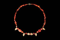 GREEK NECKLACE WITH GOLD LEAF PENDANTS

 Ca. 3000 - 2000 BC A beautiful Greek necklace made from ancient carnelian beads. These beads are strung on ...