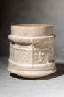 ROMAN SIDONIAN PYXIS DEPICTING ALTARS

 Ca. AD 1 - 100 A Stunning Roman Sidonian pyxis with an octagonal body and a slightly convex cylindrical neck...