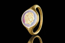 ROMAN GOLD RING WITH ALEXANDER THE GREAT

 Ca. 100 BC - AD 200 An incredible Roman inlaid gold ring depicting Alexander the Great. The plain gold ho...