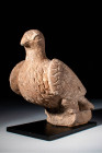 ROMAN STONE STATUETTE OF A DOVE

 Ca. AD 100 - 300 An ancient Roman stone statuette carved in the shape of a dove. The bird is rendered in an extrem...