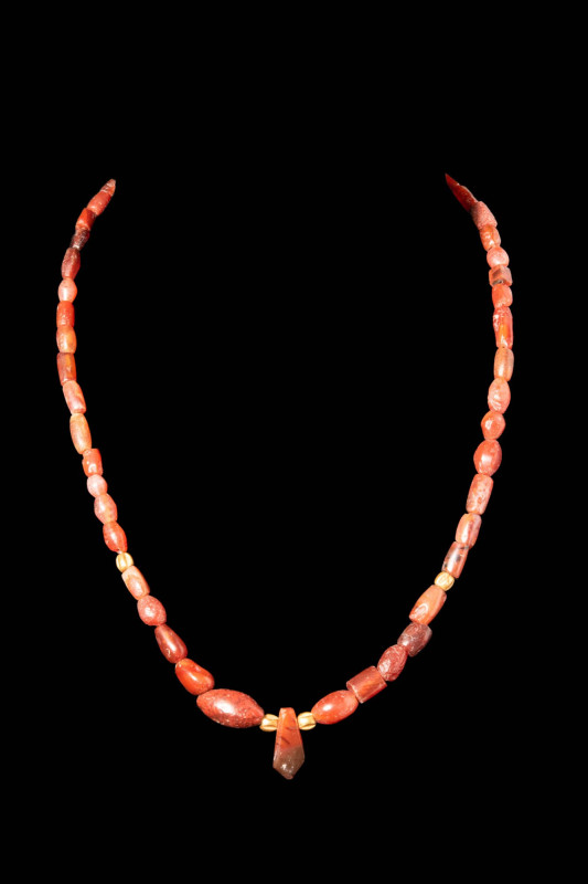 EGYPTIAN RED JASPER NECKLACE WITH A POLYGONAL PENDANT

 Ca. 600 - 400 BC An Eg...