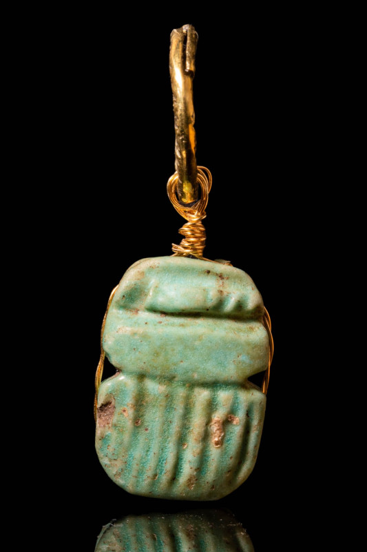 EGYPTIAN FAIENCE SCARAB IN GOLD PENDANT

 Ca. 664 - 30 BC An Egyptian late-per...