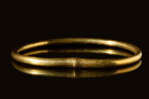 HEAVY CELTIC GOLD BRACELET 

 Ca. 500 - 300 BC A Celtic gold bracelet of an open circular form with conical terminals and flattened ends. The band o...