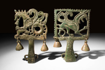 A PAIR OF SCYTHIAN BRONZE FITTINGS

 Ca. 500 - 300 BC A pair of Scythian cast-bronze heads of sceptres, each in the shape of a reclining griffon wit...