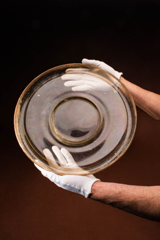 ROMAN GLASS PLATTER ON SHORT PEDESTAL

 Ca. AD 0 - 200 A mould-blown pale yell...