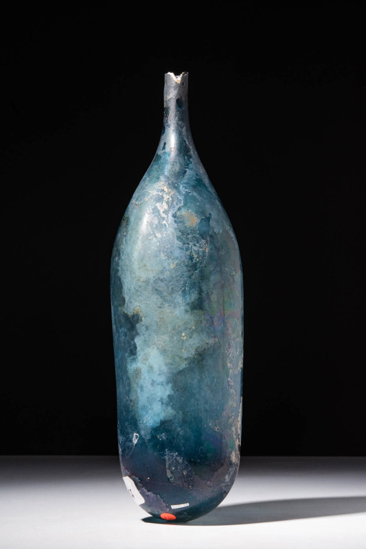 ROMAN DEEP BLUE GLASS PYRIFORM BOTTLE

Ca. AD 100 - 300 A Roman blue glass bot...