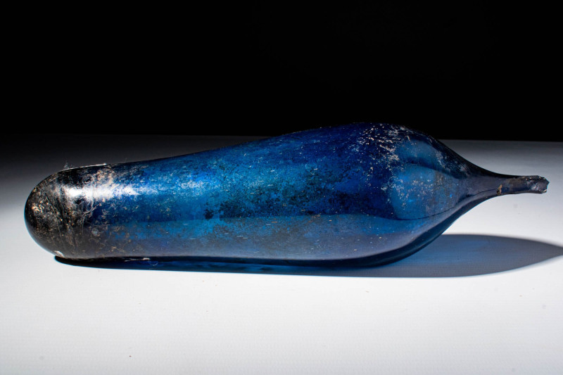 ROMAN DEEP BLUE GLASS PYRIFORM UNGUENTARIUM

 Ca. 100 BC - AD 100 A Roman blue...