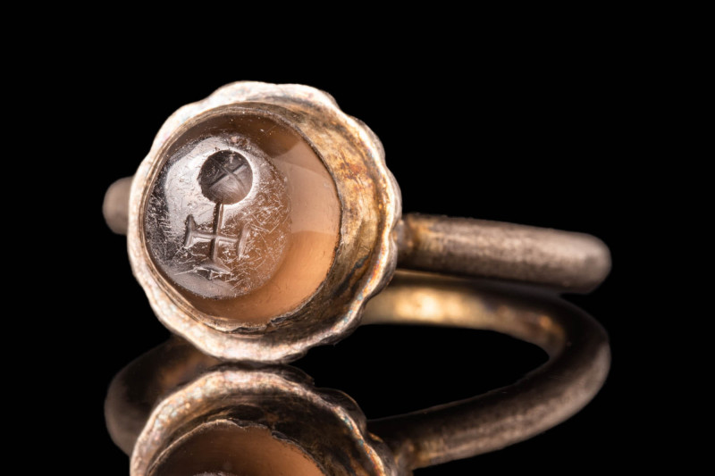 BYZANTINE GOLD INTAGLIO RING DEPICTING A CHRISTIAN SYMBOL

 Ca. AD 500 - 700 A...