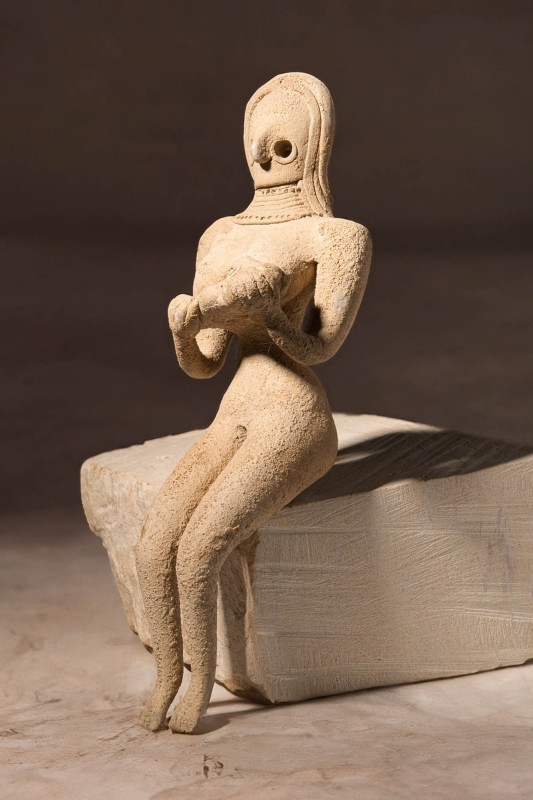 INDUS VALLEY TERRACOTTA STATUETTE OF MOTHER HOLDING THE CHILD

 Ca. 3500 - 280...