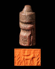 BACTRIAN OR CENTRAL ASIAN HAMMER SEAL WITH THE TREE OF LIFE

 Ca. 2nd to 1st millennium BC A Bactrian or central Asian cylinder seal depicting a fig...