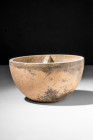 BACTRIAN COSMETIC PALETTE

 Ca. 3000 - 2000 BC A Bactrian cosmetic palette made from a lightweight stone, possibly anthracite. Round in shape on a d...