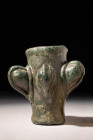 WESTERN ASIATIC BRONZE BATTLE MACE HEAD

 Ca. 1200 - 800 BC An elegant Western Asiatic bronze mace head composed of a cylindrical socket body embell...