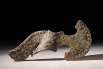 WESTERN ASIATIC BRONZE BATTLE DOUBLE AXE HEAD 

 Ca. 1200 - 800 BC A Western Asiatic bronze axe-head with an imposing blade extending from a lengthy...