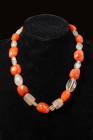 WESTERN ASIATIC NECKLACE WITH RIBBED MELON BEADS

 Ca. 2200 - 1800 BC A stunning necklace made from carnelian, quartz and crystal rock worked into m...