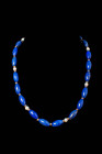 WESTERN ASIATIC NECKLACE WITH LAPIS LAZULI AND GOLD BEADS

 Ca. AD 1600 - 1800 A beaded necklace with intense blue ovoid lapis lazuli beads alternat...